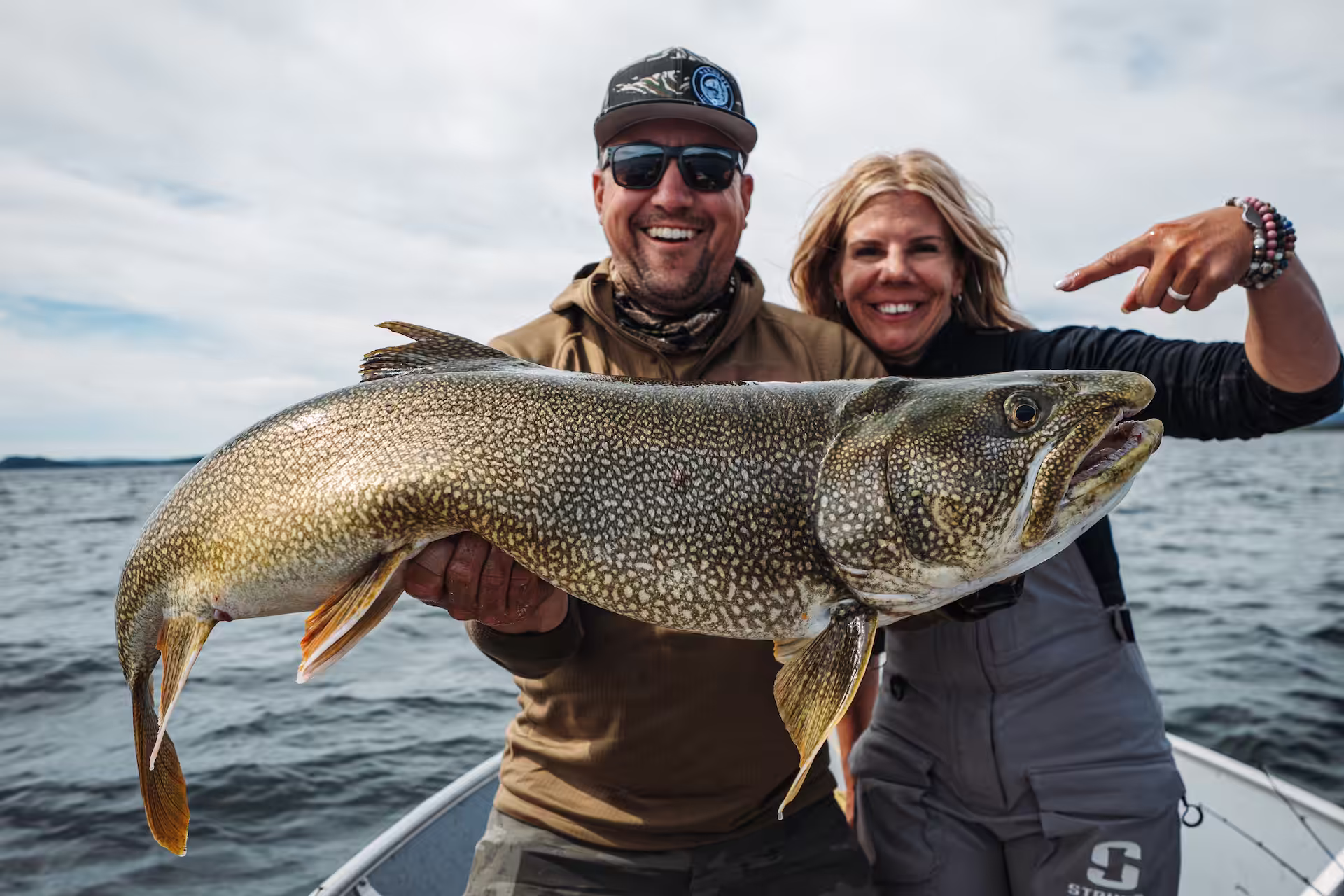 Famous angler Lisa Roper posing with a trophy lake trout caught at Cheemo Lodge.